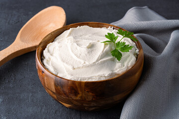 Traditional yogurt, full-fat or nonfat. Yogurt made from cow's or goat's milk on black background