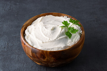 Traditional yogurt, full-fat or nonfat. Yogurt made from cow's or goat's milk on black background