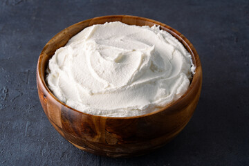 Traditional yogurt, full-fat or nonfat. Yogurt made from cow's or goat's milk on black background	
