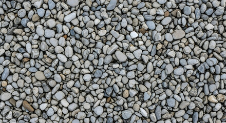 Overhead shot of a natural collection of gray pebble stones background