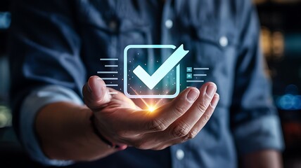 Man s outstretched hand presenting a glowing digital checkmark within a transparent box symbolizing approval and completion