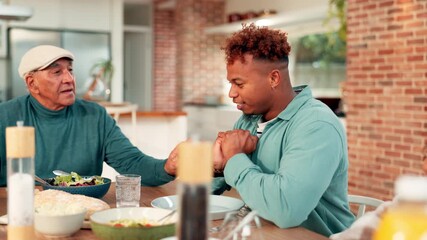 Family, praying and holding hands with food at house for gratitude, blessing meal and appreciation. People, prayer and thankful grace for breakfast reunion, religious tradition and christian practice