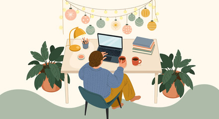 Person working at a desk with laptop and plants during the holidays.