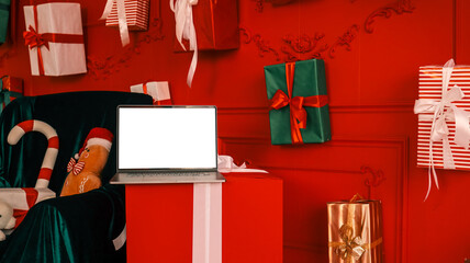 Christmas scene with laptop, gifts, and festive decorations in red and green