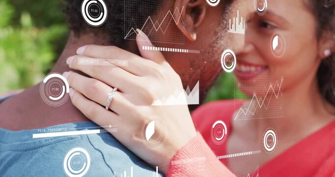 Woman holding man's neck in park HUD graphics appearing animating charts highlighting ring for tech