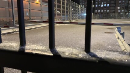 Closed off area with high fence and barrier. Guarded parking with complex access system. Evening parking is available in guarded area with gate and barrier at the entrance