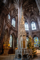 Gothic tabernacle and stained glass inside St. Lorenz Church in Nuremberg, Germany.