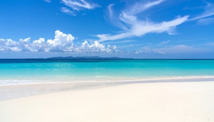 Fototapeta premium Stunning coastal scene: azure waters meet pristine sands under a vibrant blue sky