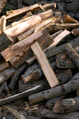 A pile of chopped firewood in the open air.