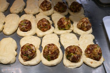 Making of Tujia meat pie - xian bing. Regional Chinese cuisine in Shenzhen.