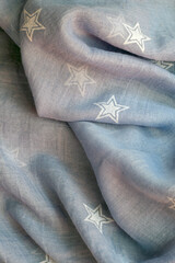 Blue and white scarf with stars on it