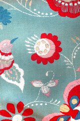 Blue and red floral print with a hummingbird and butterflies