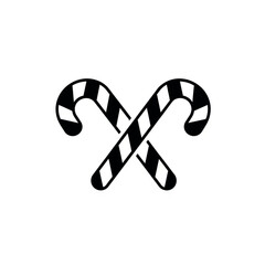 Fototapeta premium Two black and white striped candy canes crossed on white background christmas sweet