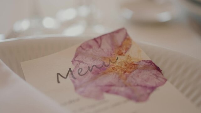 elegant menu card adorned with soft pressed petals