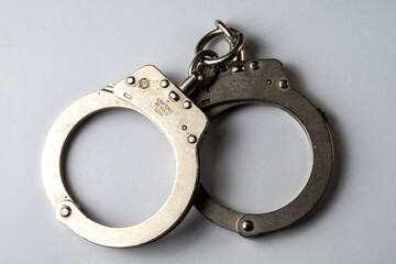 Single Metal Handcuff on White