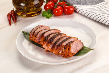 Sliced duck breast baked with cherry