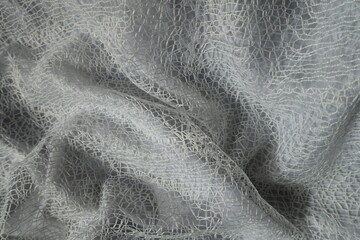 white web like lacy fabric in soft folds
