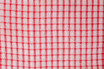 Red and white checkered dish cloth cloth with frayed edges