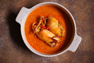 Padang style spicy curry squid in a bowl 