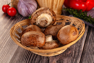 Raw brown champignon heap for cooking