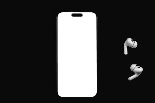 mockup mobile smartphone iPhone with transparent png, empty screen template with AirPods headphones on black background. Batumi, Georgia - September 7, 2025