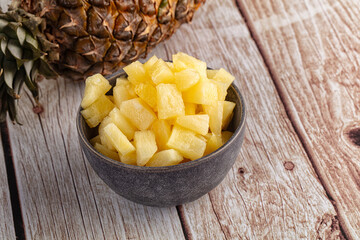 Sweet canned pineapple fruit pieces