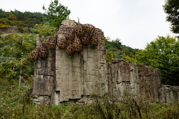 Stone in the park decorated with traditional wicker fish traps in Danyang County, South Korea