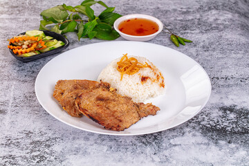 Roasted pork steak with rice