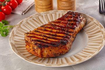 Grilled pork steak with bone