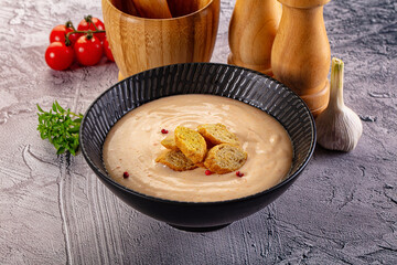 Tasty cheese cream soup with crouton