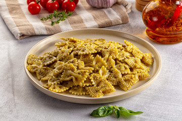 Italian green pasta farfalle with pesto