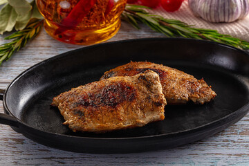 Roasted pork schnitzel steak piece