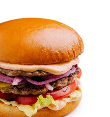 Juicy hamburger stacked with patties, fresh vegetables, and special sauce