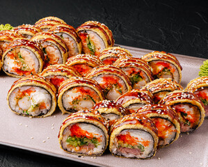 Delicious assortment of sushi rolls served on a platter at a restaurant