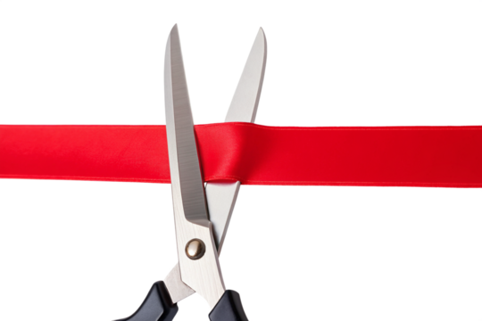 Scissors cutting vibrant red ribbon at grand opening ceremony, symbolizing new beginnings and business launch