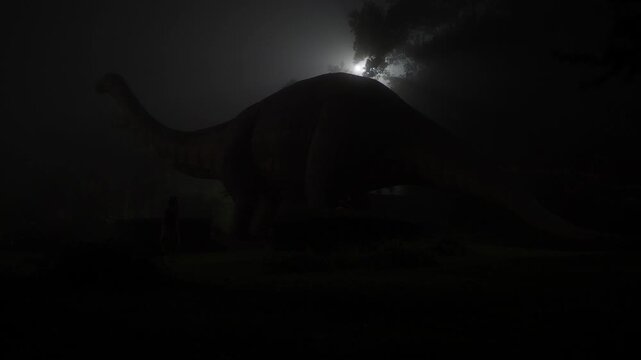 Dinosaur simulation at night in the park