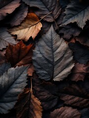 A textured arrangement of dark autumn leaves in earthy tones, showing detailed veins and soft shadows for a moody natural background