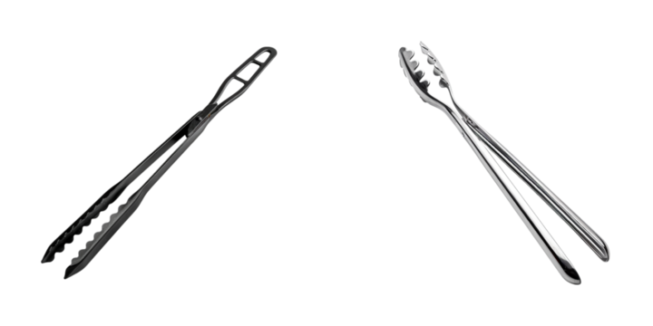 Studio shot of two pairs of silver stainless steel food serving tongs