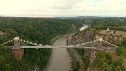 Bristol UK: 28th July 2025: Drone view of Clifton Suspension Bridge under restoration with scaffolding over the River Avon (Avon Gorge) wide shot