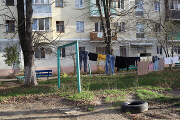 5-storey buildings in the courtyard with a clothesline for drying washed clothes