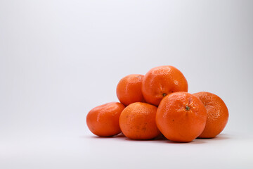 A Large Group Of Vibrant Orange Citrus Fruits Stacked Together. Symbol Of Winter Holidays, New Year Celebration And Abundance.