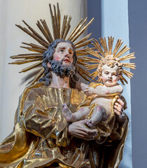 SALZBURG, AUSTRIA - SEPTEMBER 6, 2025: The carved baroque polychrome statue of St. Joseph in the...