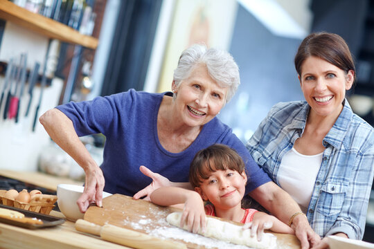 Happy family, portrait and baker generation with mother in kitchen for fun learning or development. Mom, grandma and baking with child or wooden board for dough, dessert or recipe together in home