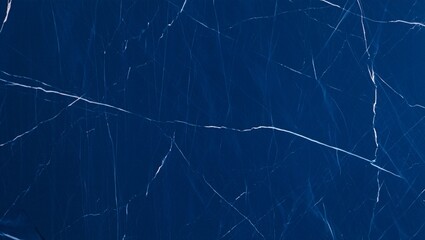 Naklejka premium Dark blue polished navy marble with elegant white veins and light reflections, creating a luxurious and sophisticated surface texture suitable for interior design, architecture, countertops, flooring,