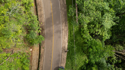 A winding road through the dense forest of Sumba, the main road connecting the regencies on Sumba Island