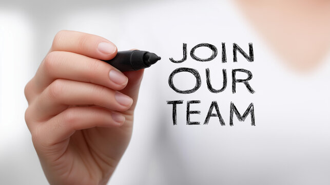 Hand writing join our team with a marker on a clear surface, symbolizing recruitment, employment opportunities, and building a professional career workforce