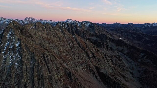 Breathtaking view of Colle della Lombarda at sunset, serene mountain peaks