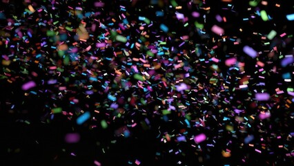 Colorful confetti pieces fall against a dark background. Concept Confetti Shower, Dark Backdrop, Colorful Confetti, Motion and Blur, Festive Atmosphere