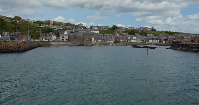 Wide shot looking at the village of Gourdon and Harbour from the pier