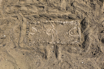 Simple drawing made in the sand. Making a soccer field on sand